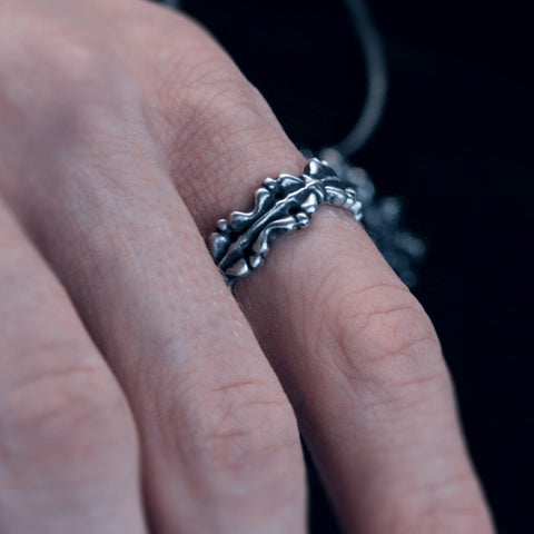 Hand-finished oxidized solid 925 Sterling Silver ring model BASTION with a thorny rose and thorn inspired design by frantic studio