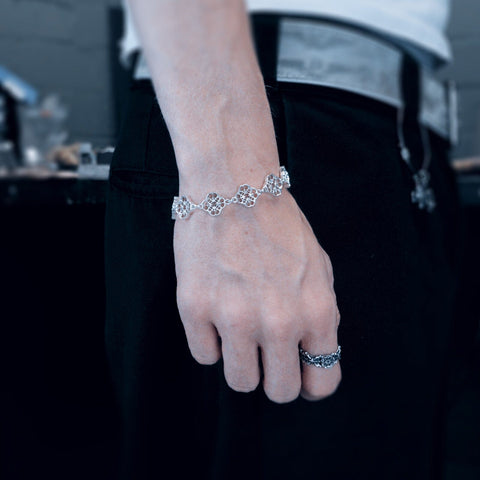 Hand-finished solid 925 Sterling Silver bracelet model CLEE featuring an intricate spider web and luck charm inspired design by frantic studio