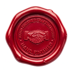 A round red wax seal with a scalloped edge, featuring an embossed handshake in the center and the words 'HAND FINISHED CRAFTSMANSHIP' and 'HAND FINISHED' on a white background.