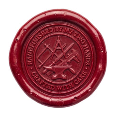 A circular red wax seal featuring embossed tools and the text 'HANDEFINISHED BY MY TWO HANDS' and 'CRAFTED WITH CARE' on a plain white background.