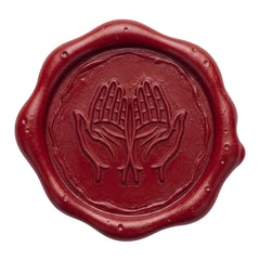 A round red wax seal with a scalloped edge and an embossed design of two hands above a leaf motif, shown on a plain white background.