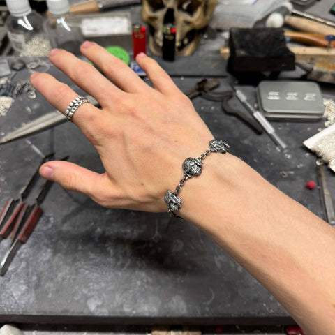 Massive hand-finished 925 Sterling Silver bracelet model OPILIORA featuring highly detailed sheep depictions with a deep sulfur-oxidized finish by frantic studio