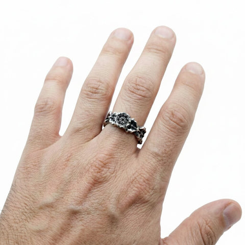 Hand-finished oxidized solid 925 Sterling Silver ring model OSMOSIS with a thorny rose and thorn inspired design by frantic studio