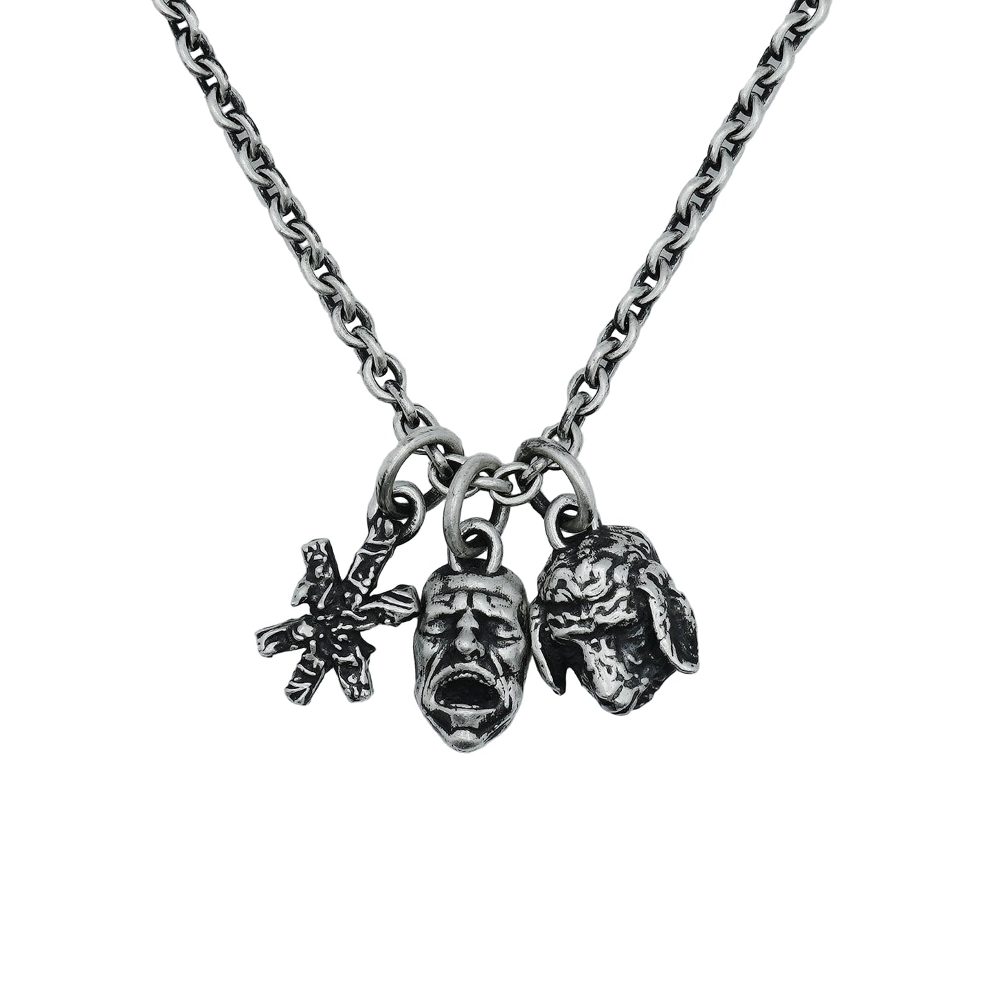 Necklace with three charms on a light gray background