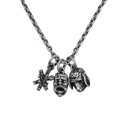 Necklace with three charms on a light gray background