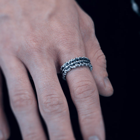 Hand-finished oxidized solid 925 Sterling Silver ring model CAVITY with deep organic textures and hollow indentations by frantic studio