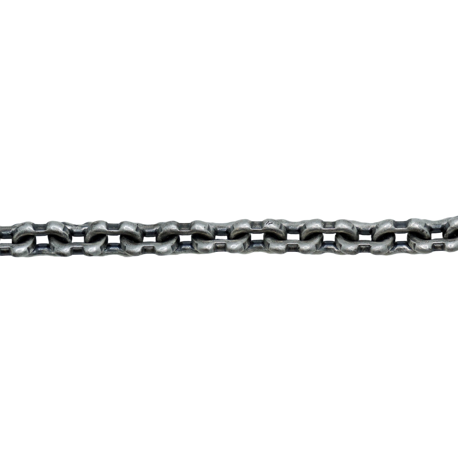 Metallic chain on a textured white surface with a light gray background