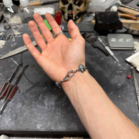 Massive hand-finished 925 Sterling Silver bracelet model OPILIORA featuring highly detailed sheep depictions with a deep sulfur-oxidized finish by frantic studio