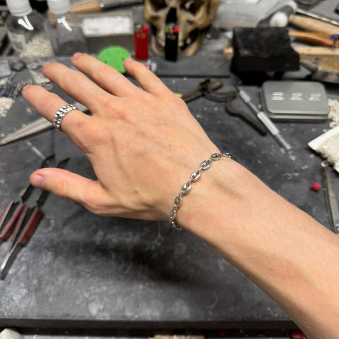 Hand-finished 925 Sterling Silver coffee bean link bracelet model PLANUS featuring a highly detailed polished surface and clean minimalist aesthetic by frantic studio