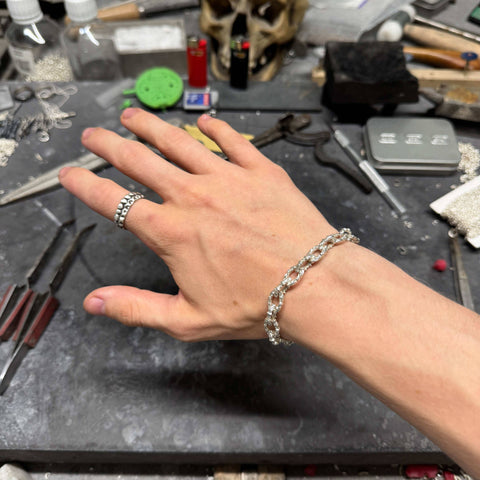 Highly detailed polished 925 Sterling Silver staple bracelet model RUPES featuring a mirror-finish and minimalist industrial design by frantic studio