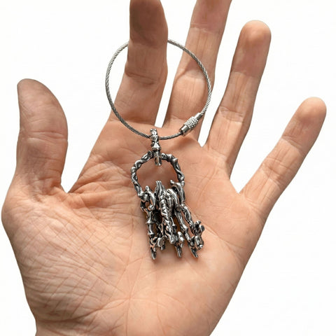 Highly detailed 925 Sterling Silver WARDEN keychain featuring an oxidized gothic key pendant, secure belt loop attachment, and versatile bag charm design by frantic studio